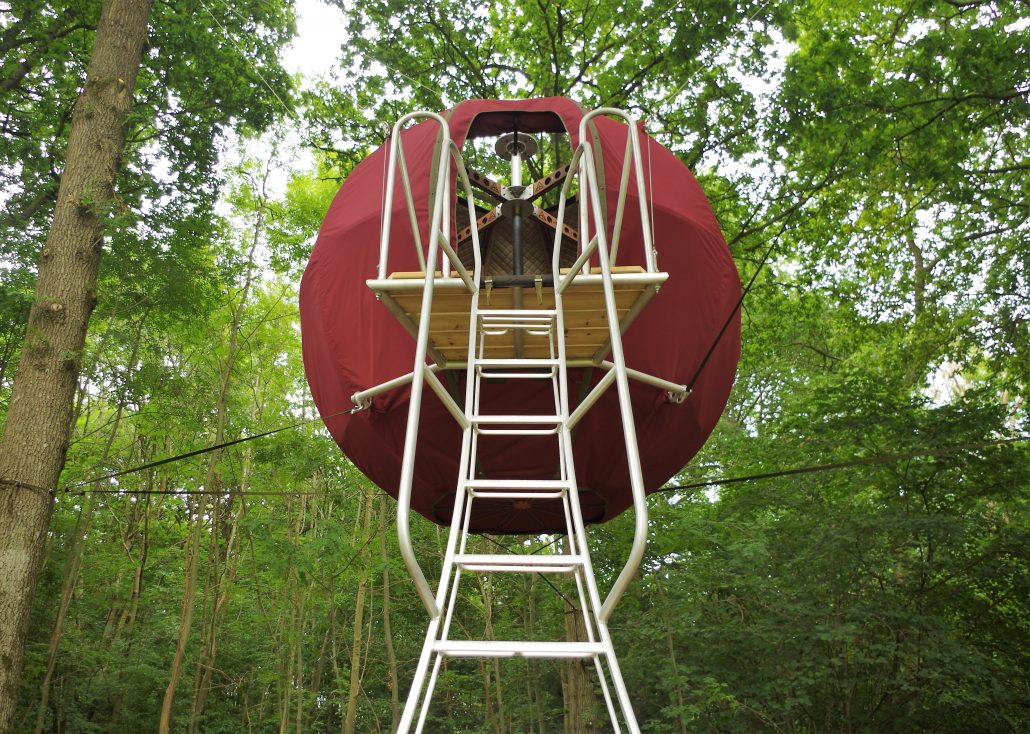 Red Tree Tent and metal stairs from below